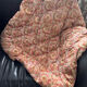 Vintage duvet/bedspread with a paisley pattern.