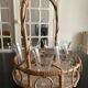 Wicker basket and 8 antique glasses