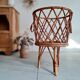 Old tripod rattan plant holder