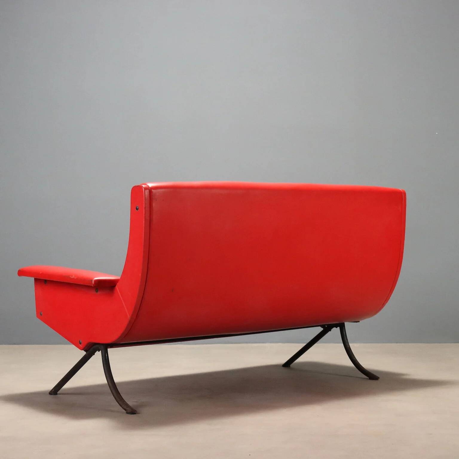 Vintage red faux leather sofa from the 1960s.