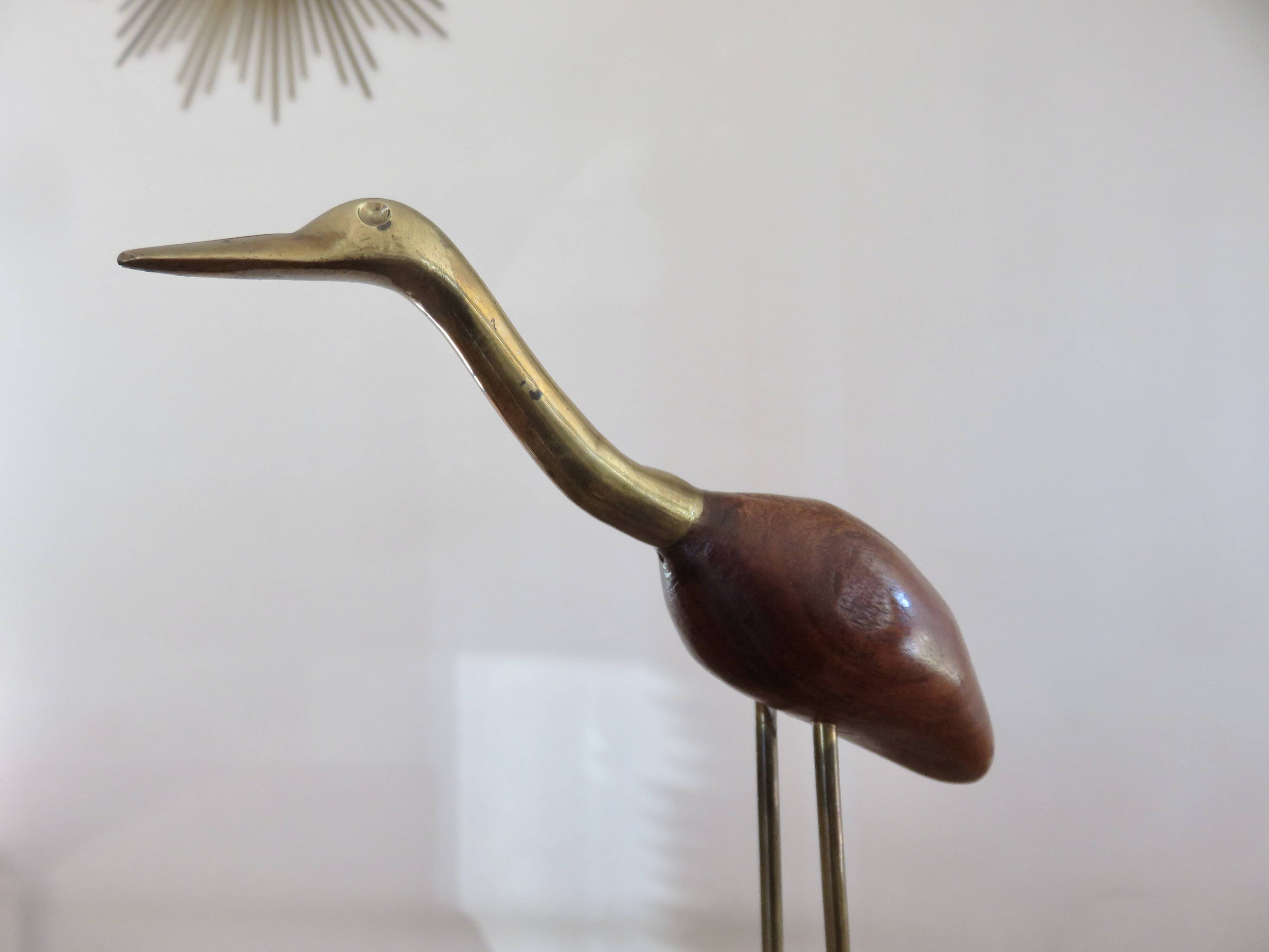 Pair of teak and brass herons from the 70s