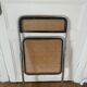 Vintage folding chair in metal and cane.
