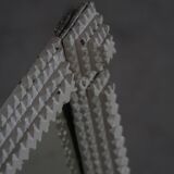 Wall mirror in tramp art style, hand-carved with a painted white frame, early 1900s.