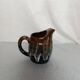 Flamed stoneware jug