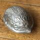 Nutcracker, shaped like a large nut, silver-plated metal