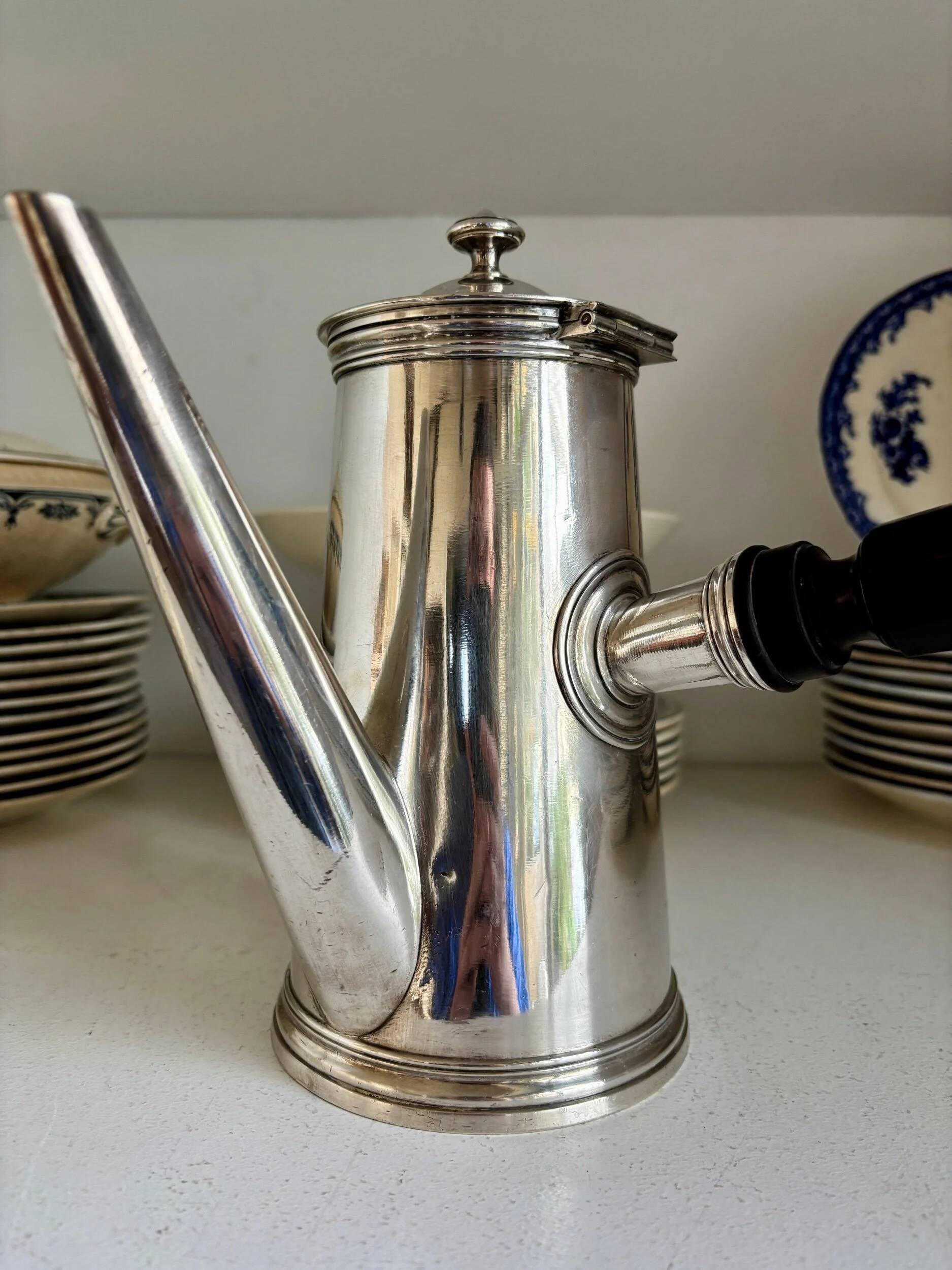 Christofle silver-plated chocolate pot and coffee pot with a blackened wooden handle.