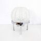 Glass table lamp on a silver base