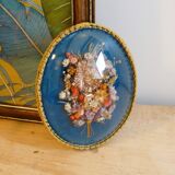 Oval frame bouquet of dried flowers with curved glass