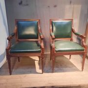 Pair of Louis XVI style armchairs upholstered in green leather.