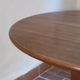 Round table with a central pedestal, light wood, 1990s.