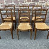 8 vintage rustic mulched chairs