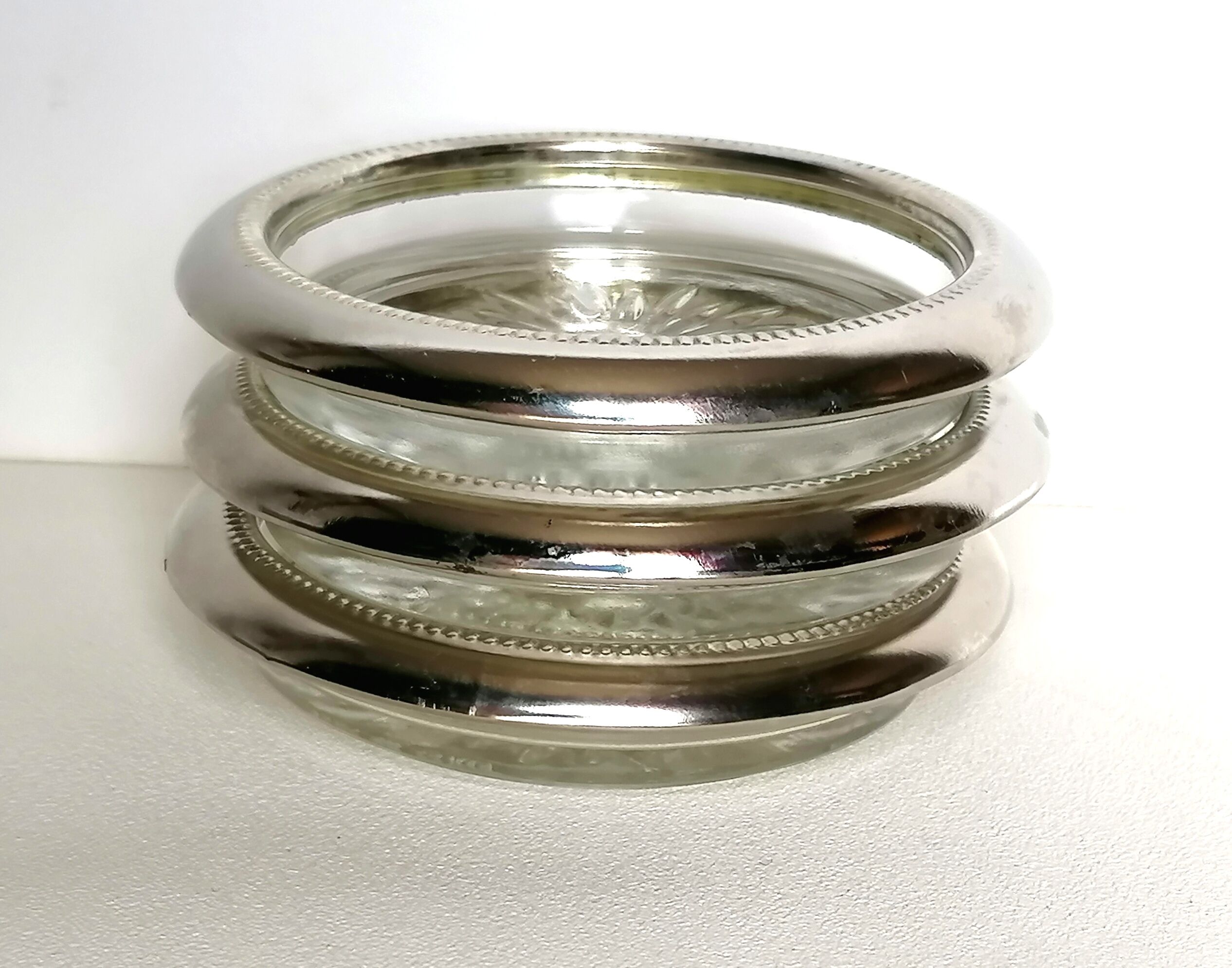 Three under silver-plated bottles