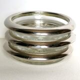 Three under silver-plated bottles