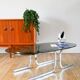 Oval coffee table in smoked glass and chrome, original double S design base, 1970.
