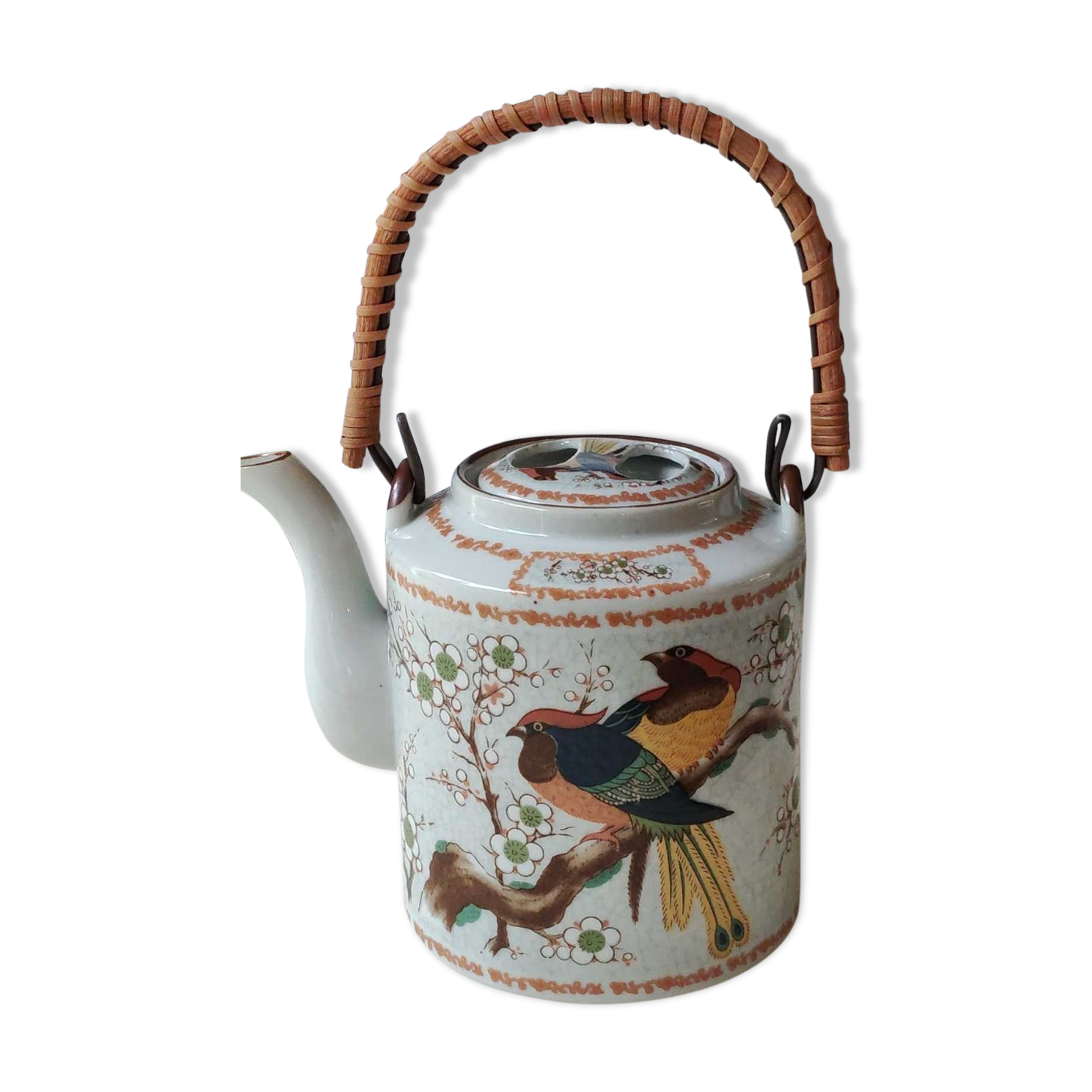 Japanese ceramic teapot. bird/paradise motifs/cherry trees. bamboo/rattan braided handle