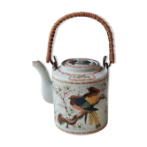 Japanese ceramic teapot. bird/paradise motifs/cherry trees. bamboo/rattan braided handle