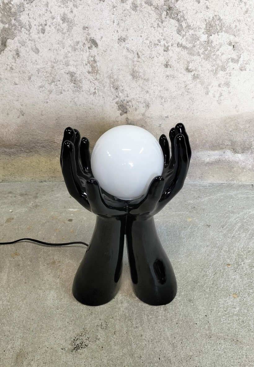 Black and white opaline hand lamp.