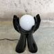Black and white opaline hand lamp.