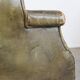 Green antique barrel back wingback chair on wheels