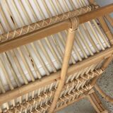 Large rattan rest chair and white cushions