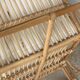 Large rattan rest chair and white cushions