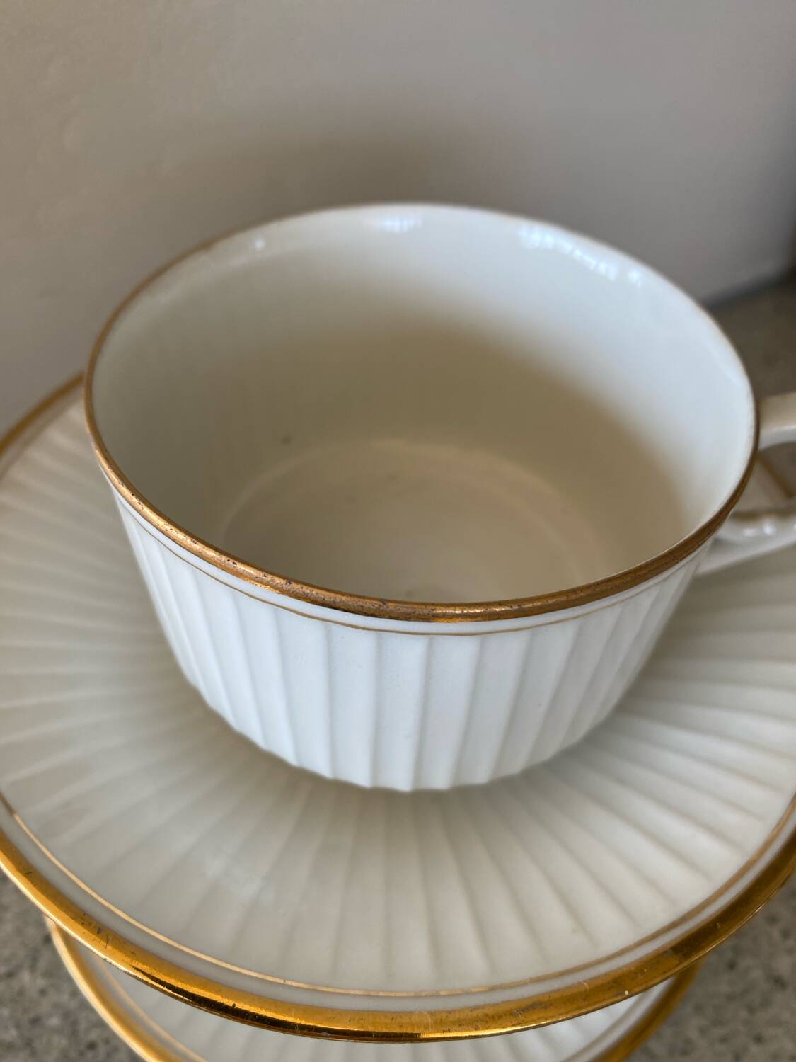 3 white and gold tea or chocolate cups