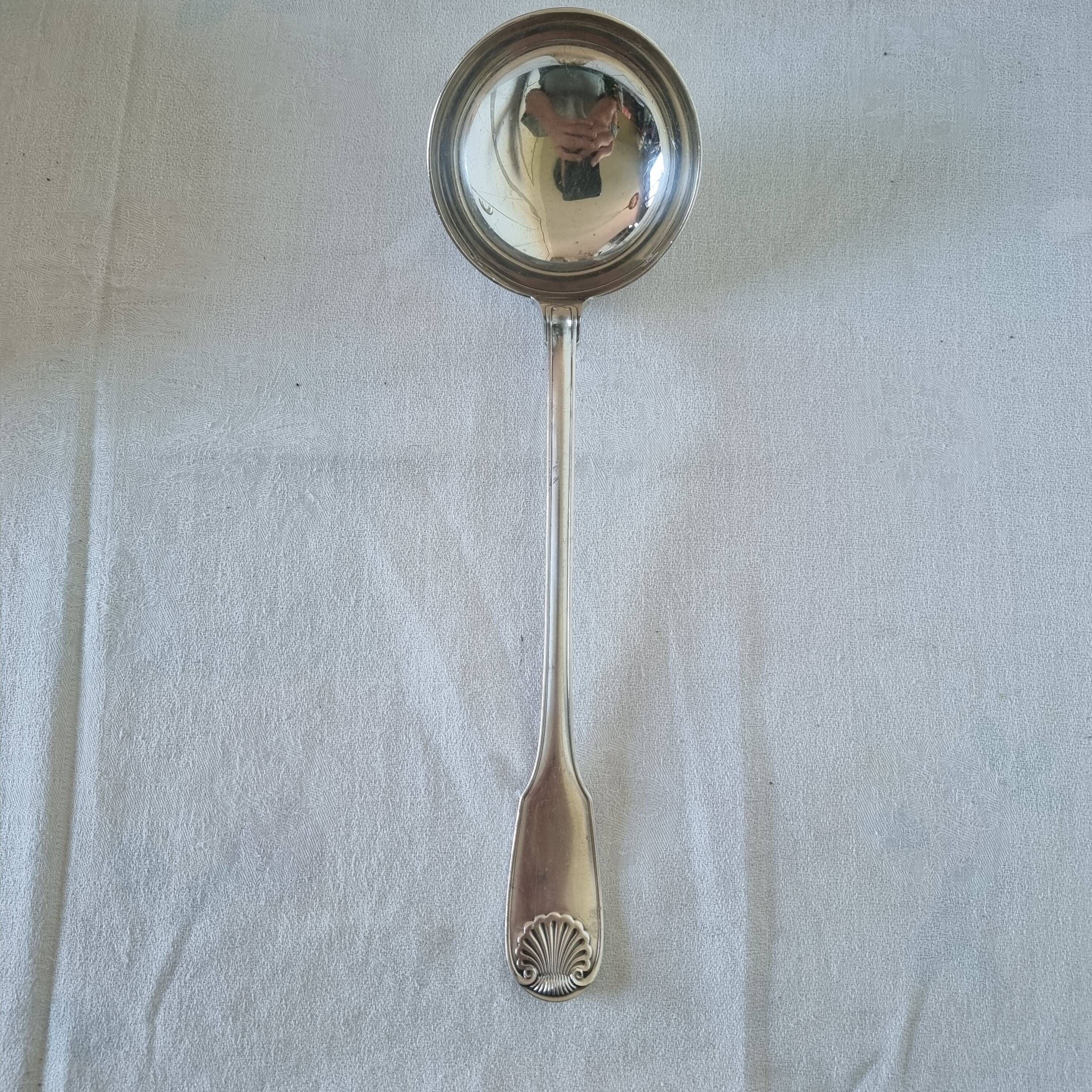 The Christofle silver-plated “Vendôme” cream ladle features a design