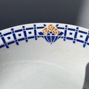 Round, shallow ceramic salad bowl from Saint Amand