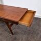 Teak coffee table with opening and drawer by Johannes Andersen for Uldum Møbelfabrik, Denmark, 1960.