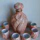 Bottle and six porcelain cups from Couleuvre