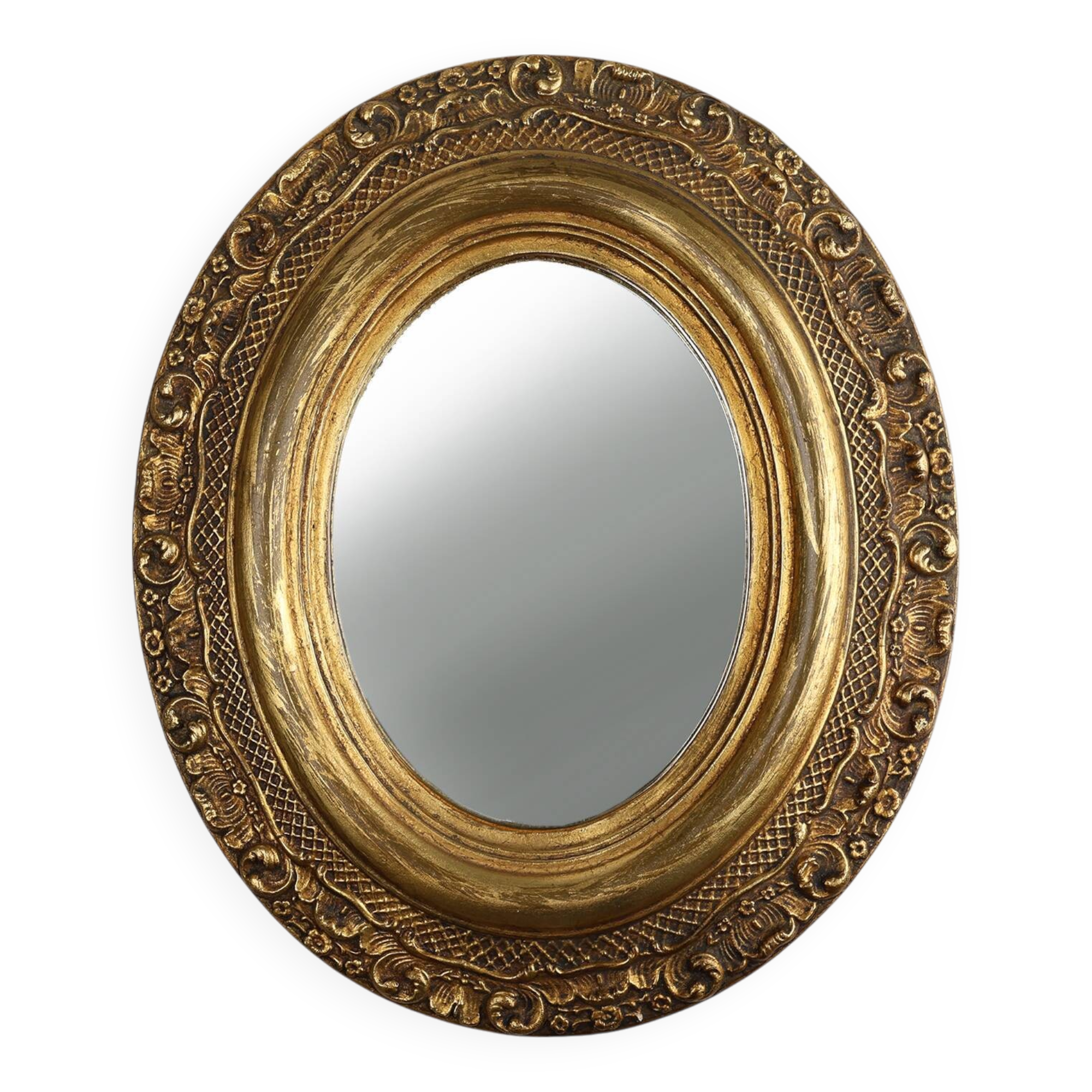 French Baroque style oval mirror in gilded wood with floral decorations