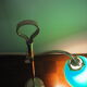Desk lamp in brass with a swan neck and green opaline glass.