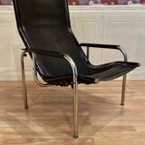 Black leather reclining lounge chair, "Hans Eichenberger" design, 1960.