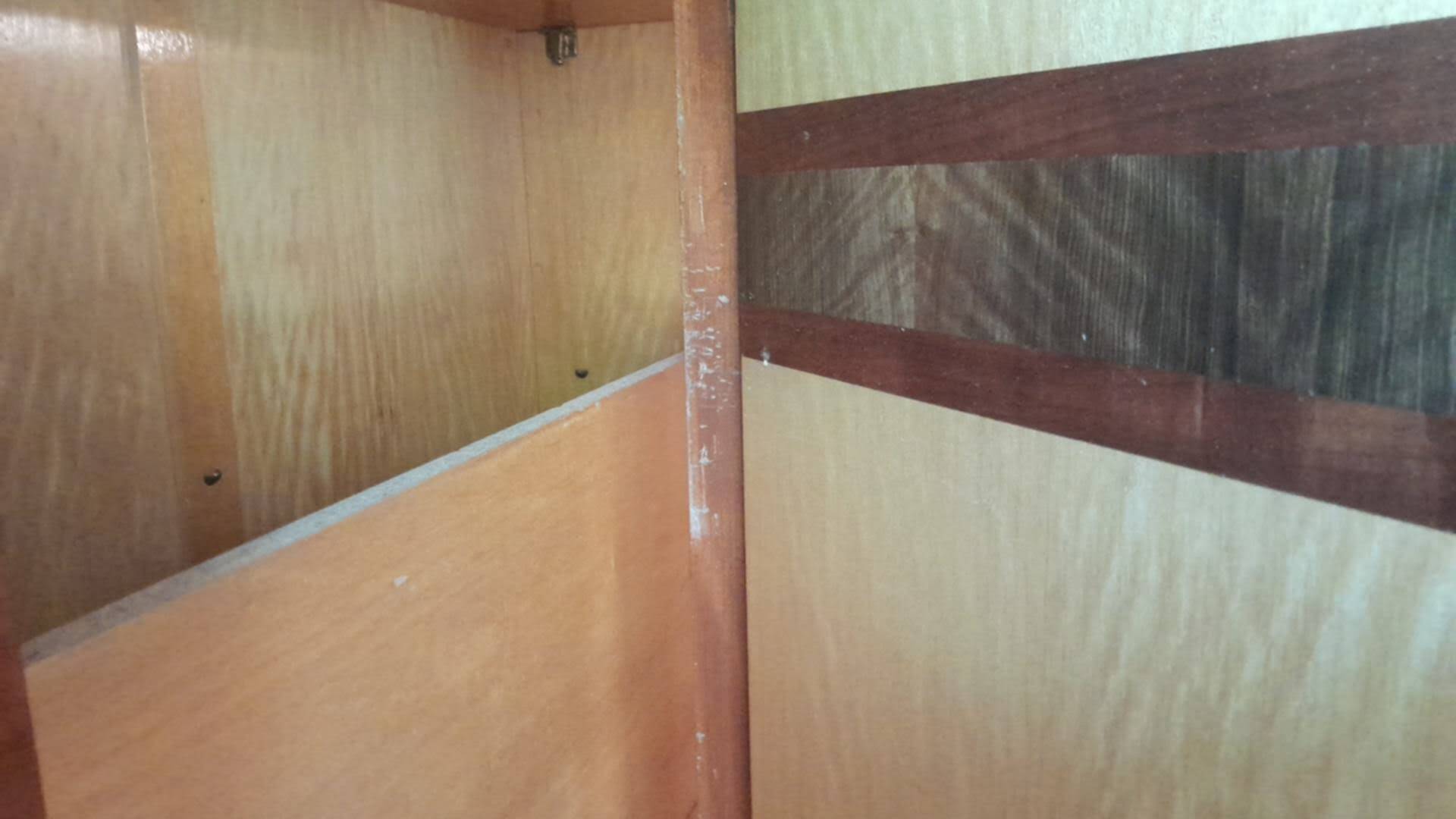 Large vintage wardrobe from the 50s/60s in wood with a mirror.
