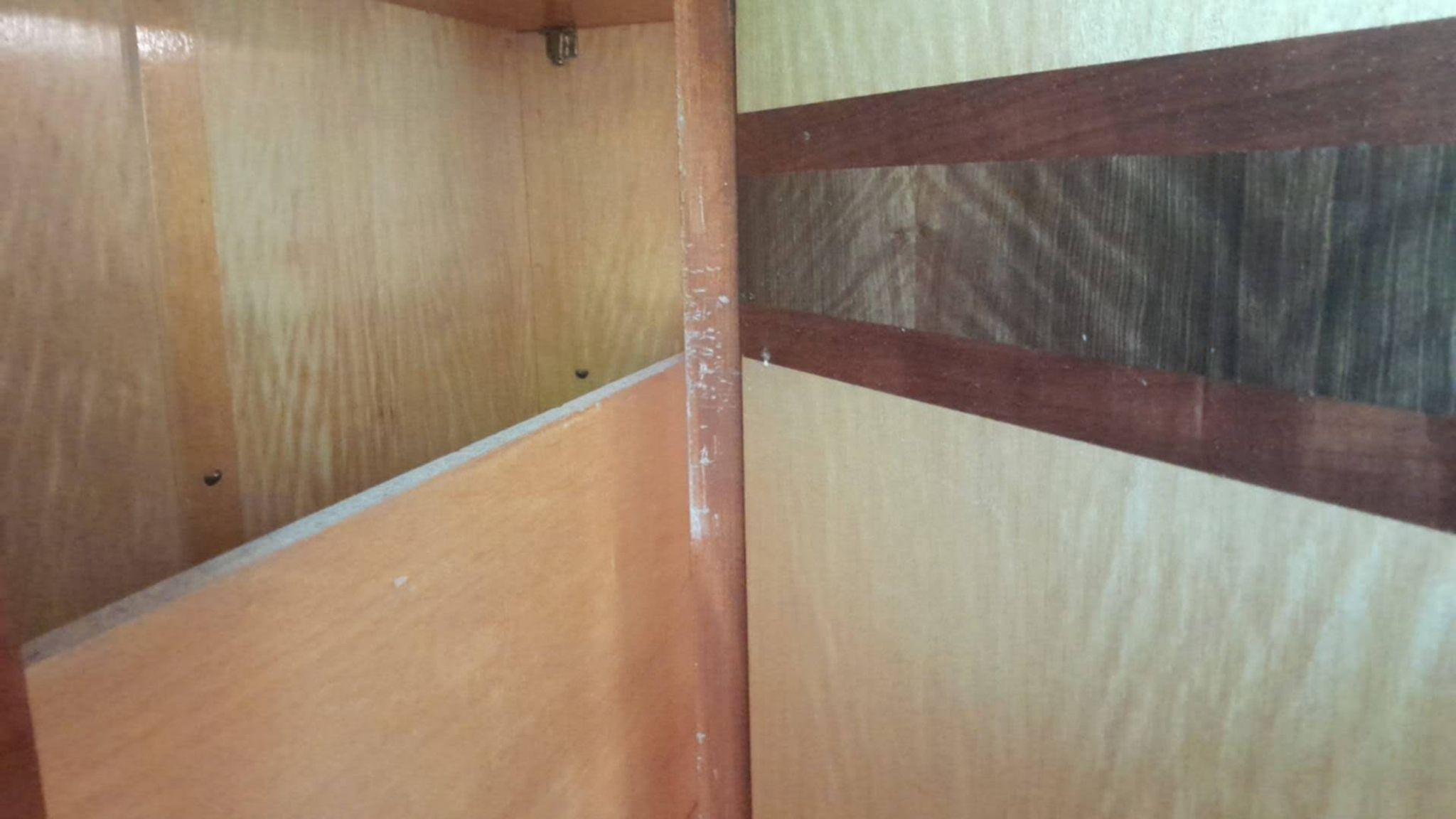 Large vintage wardrobe from the 50s/60s in wood with a mirror.