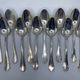 Lot de 12 cuillères à potage en métal argenté bas motif Louis XV