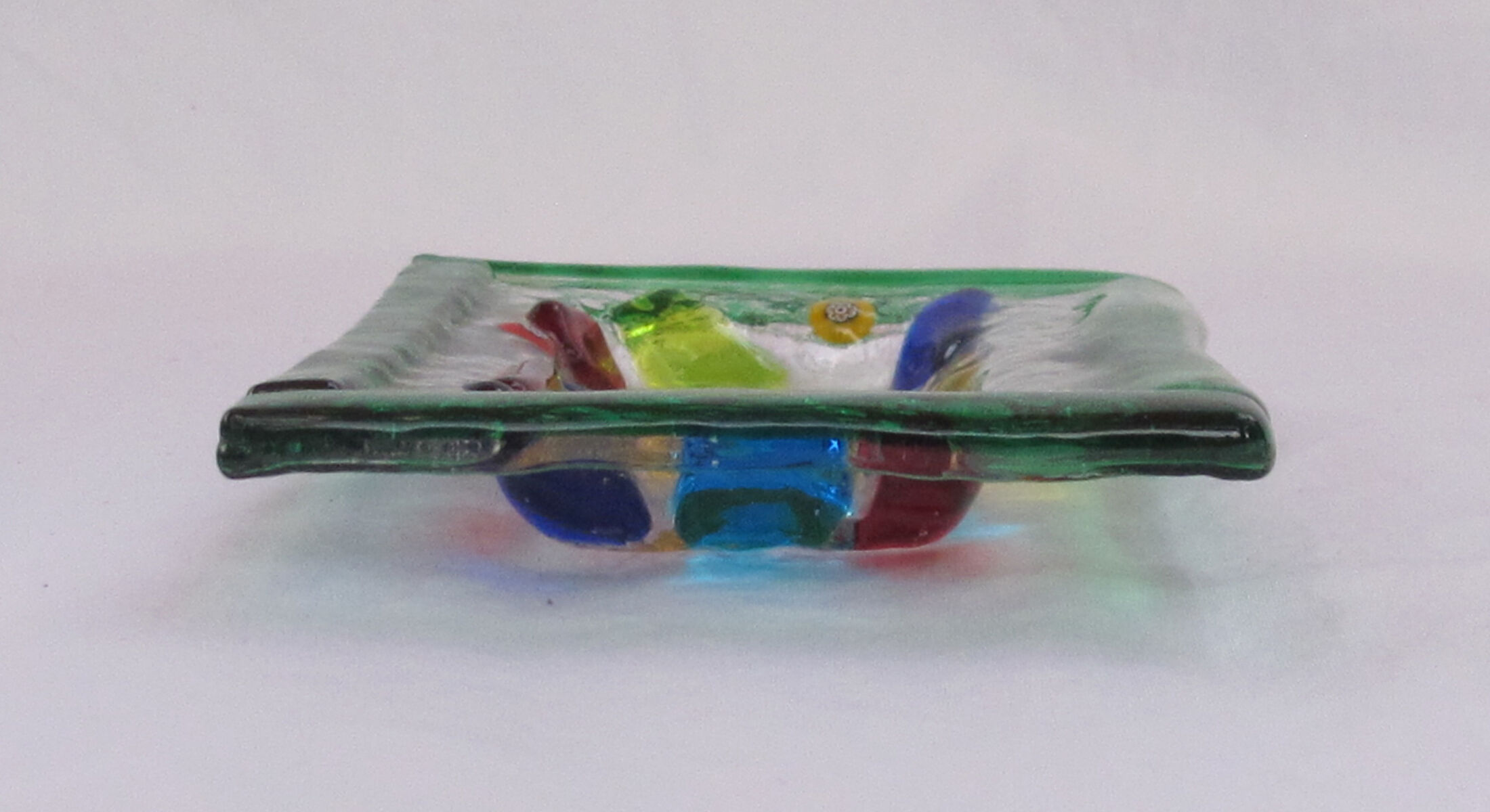 Empty millefiori-style glass pocket