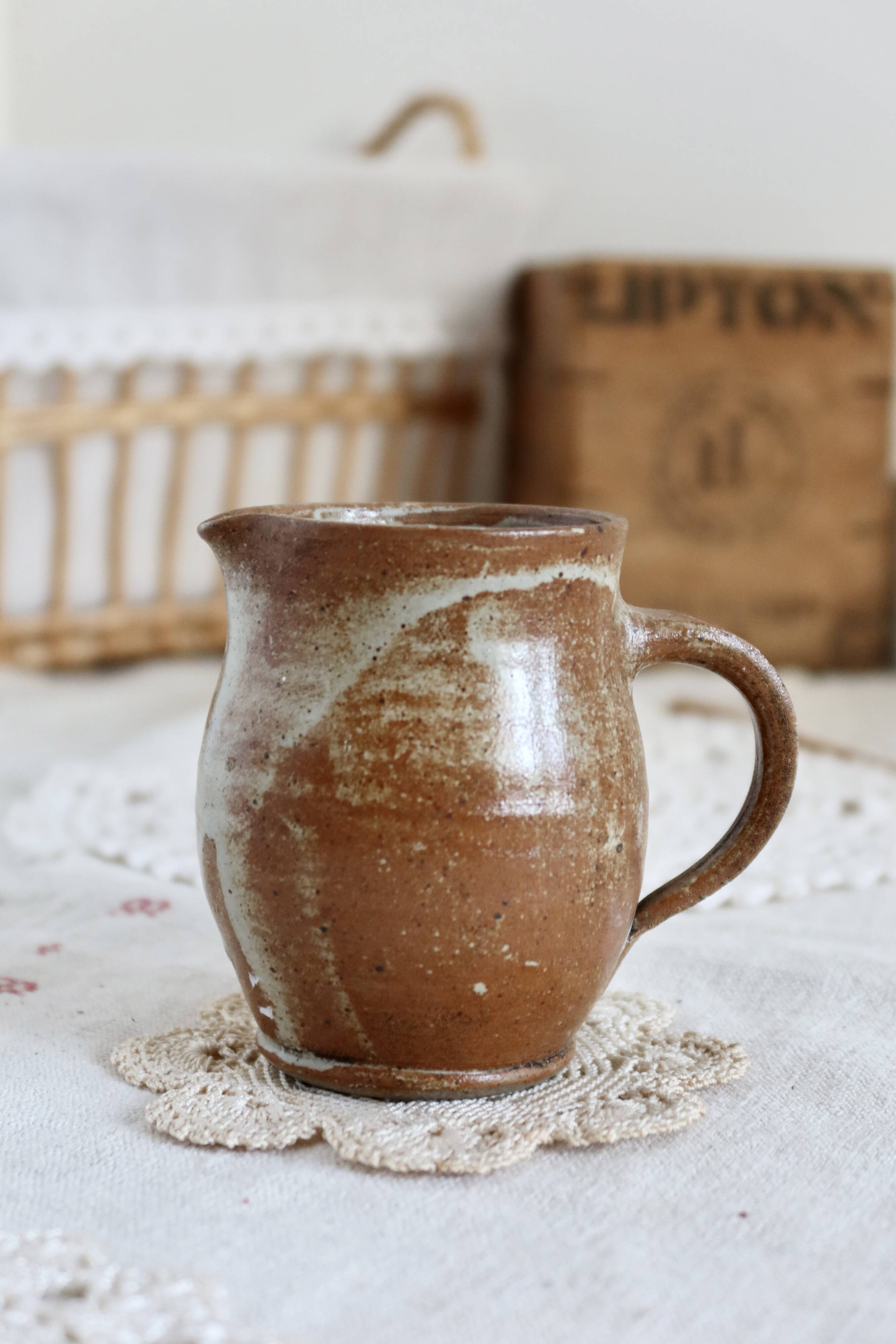Small vintage hand turned ceramic milk jug with rustic glaze