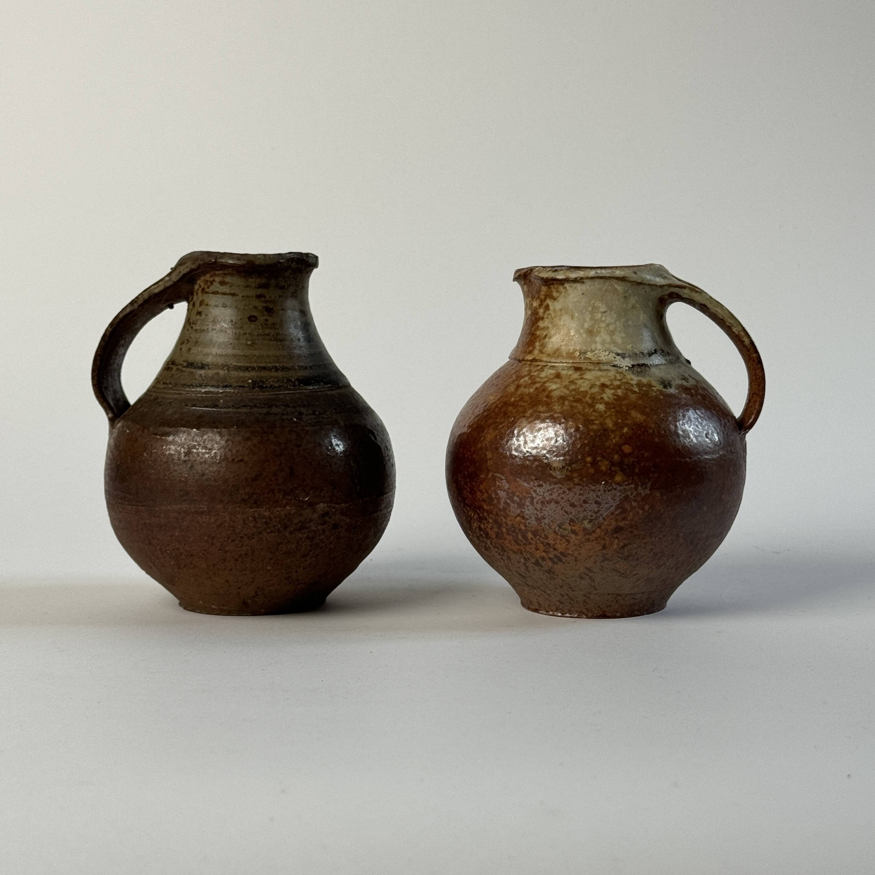 Pair of small Jacky Coville stoneware pitchers, 1970