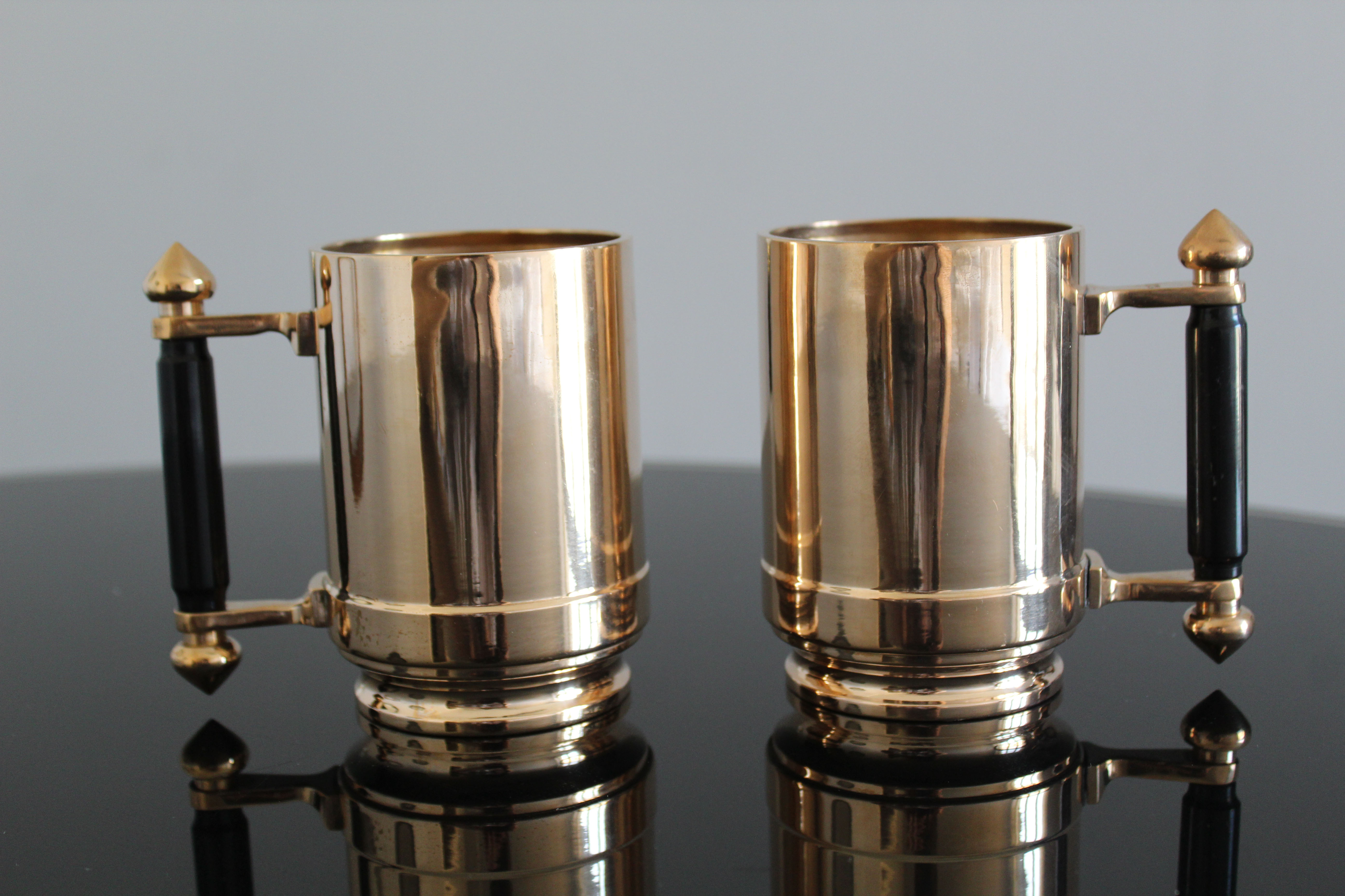 Pair of art deco bronze beer mugs France, 1940s, signed Bronze Star