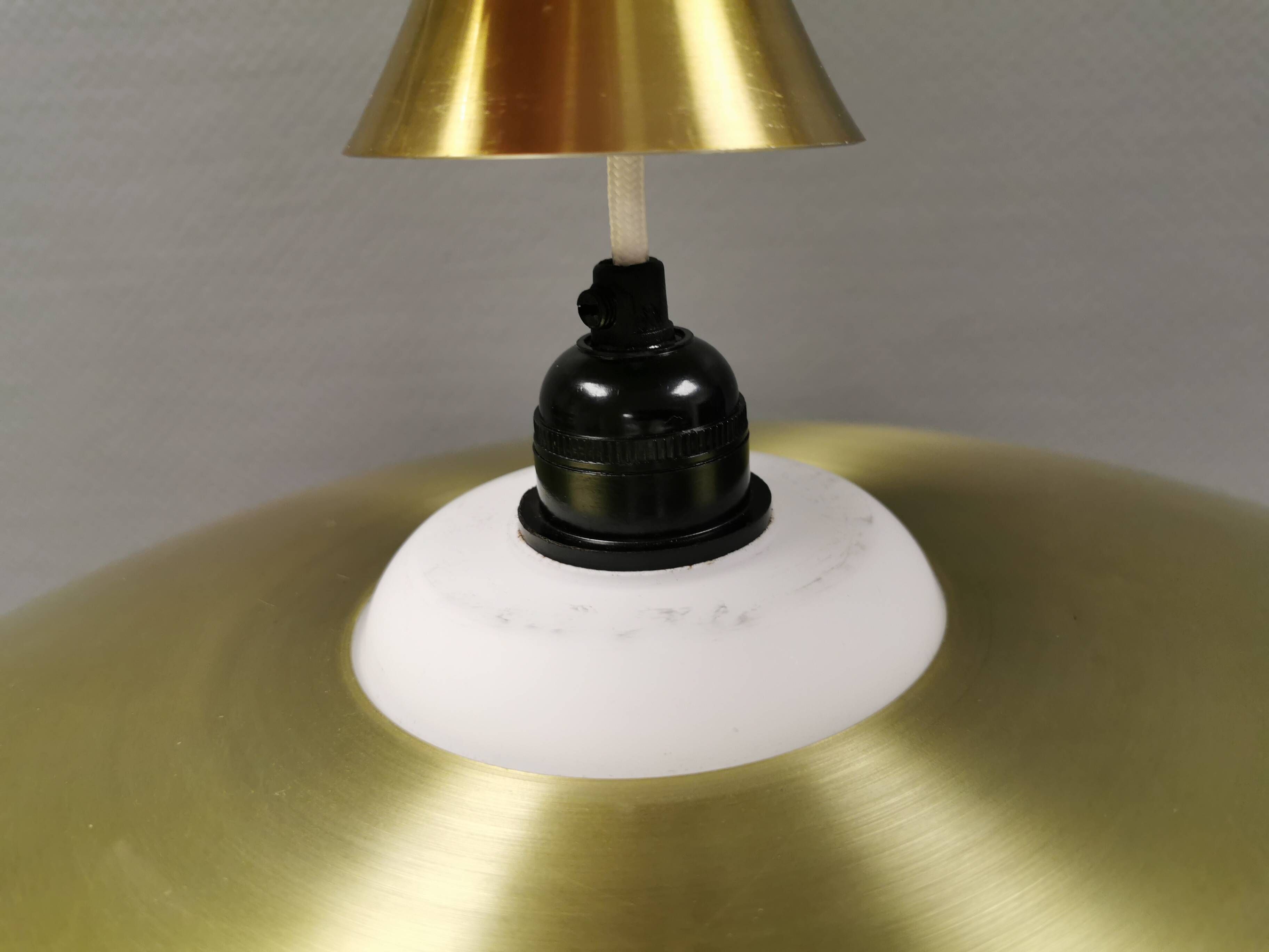 Hanging lamp, from the 1970s in matte white glass and brass colored metal.