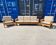 Brutalist-style bench and armchairs in 1970s pine.