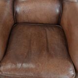 Cognac brown cow leather armchair with decorative nail finish