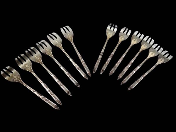Coffret de 12 fourchettes à gâteaux en métal argenté Ercuis