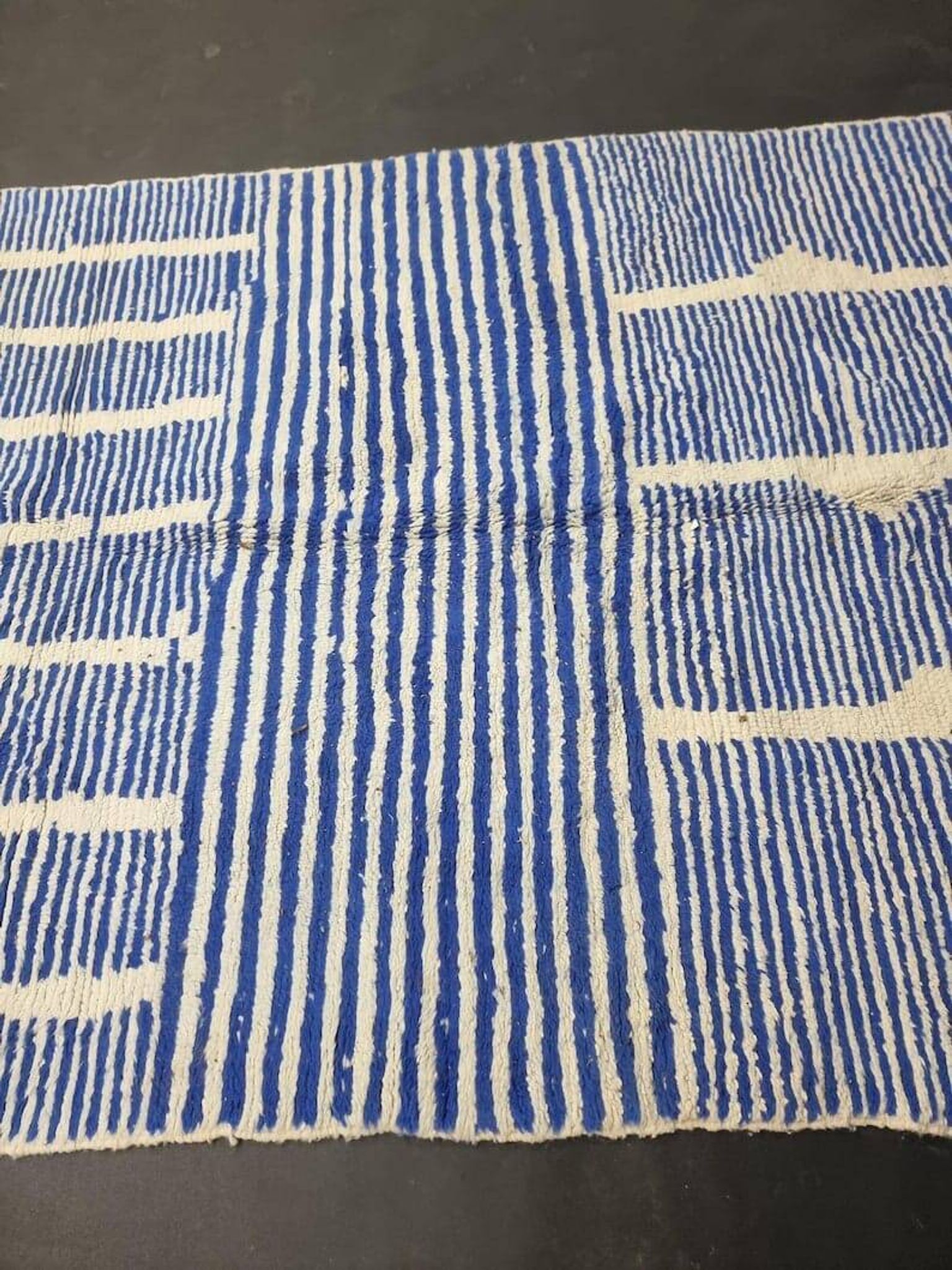 Handwoven Berber rug in blue and white, size 150x250 cm.