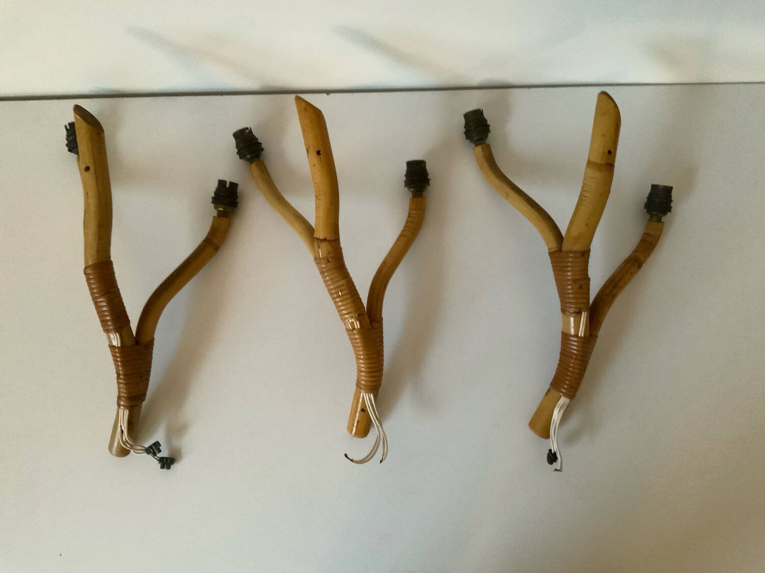 Rattan wall light trio