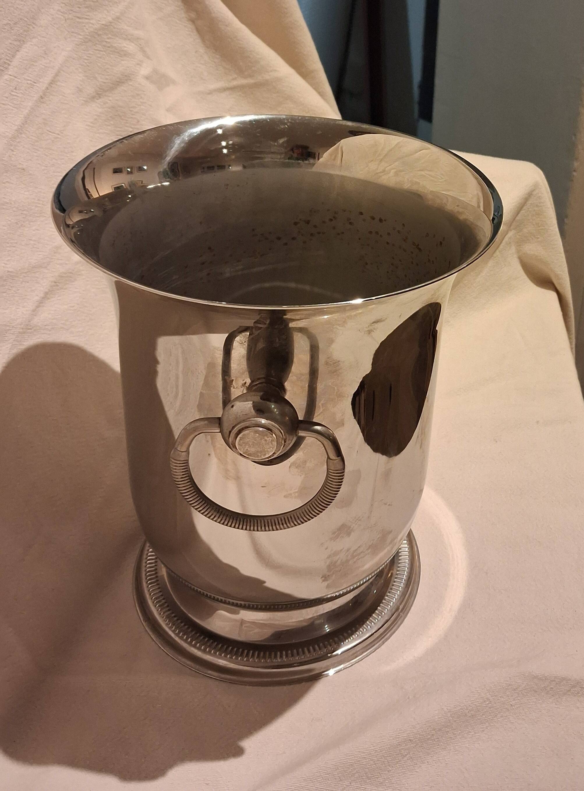 Stainless steel champagne bucket, silversmith Jean Couzon, model on a pedestal.