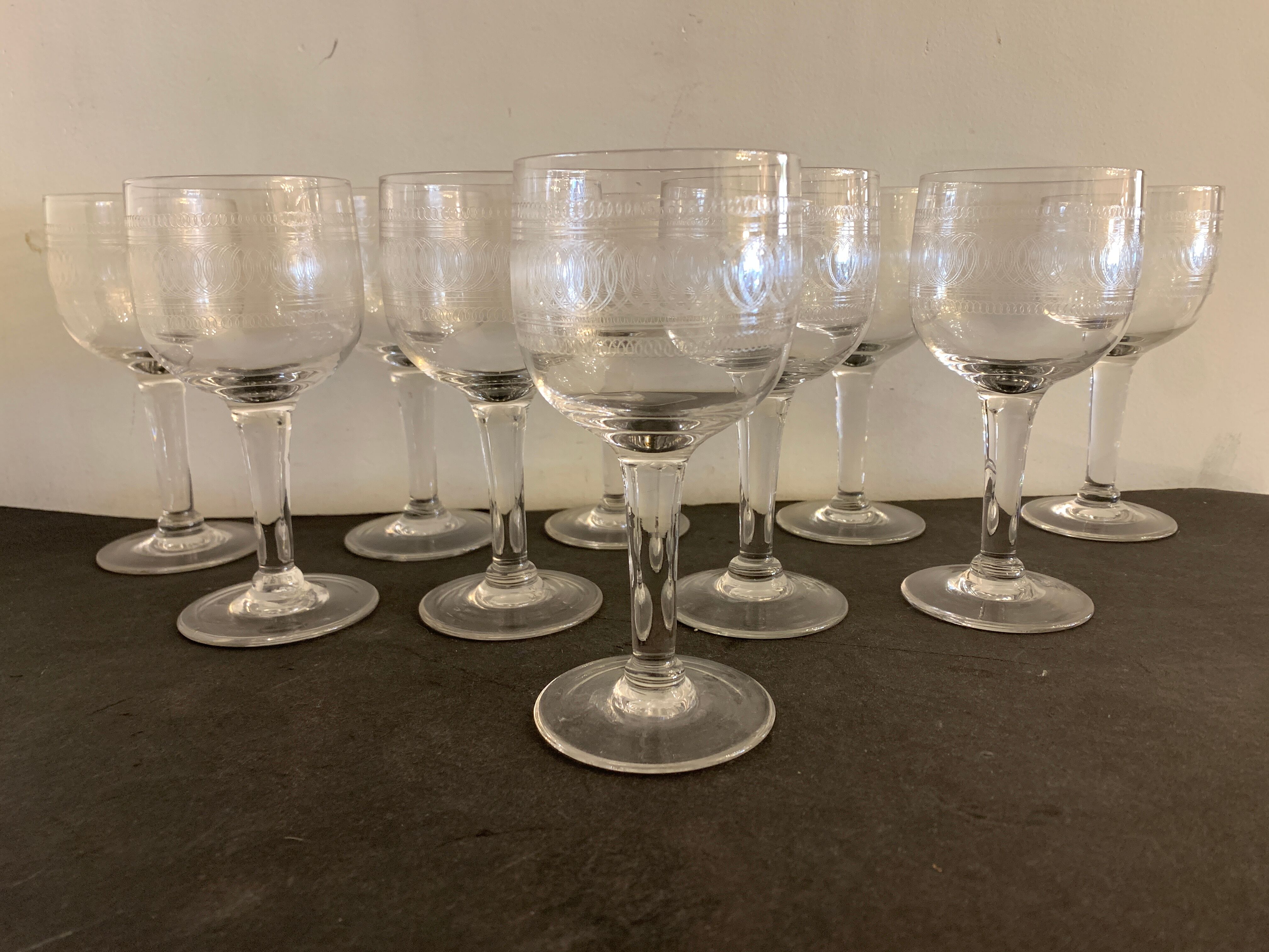 10 blown and engraved stemmed glasses