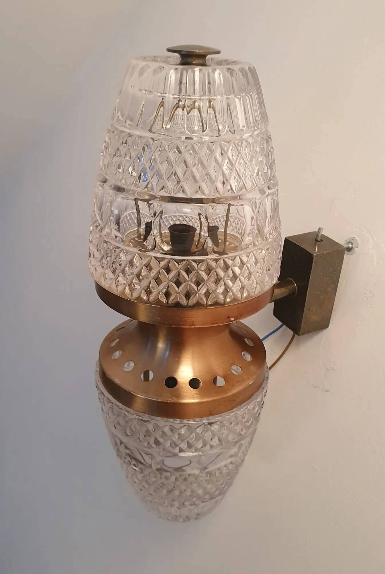 Vintage brass wall sconce with two glass globes