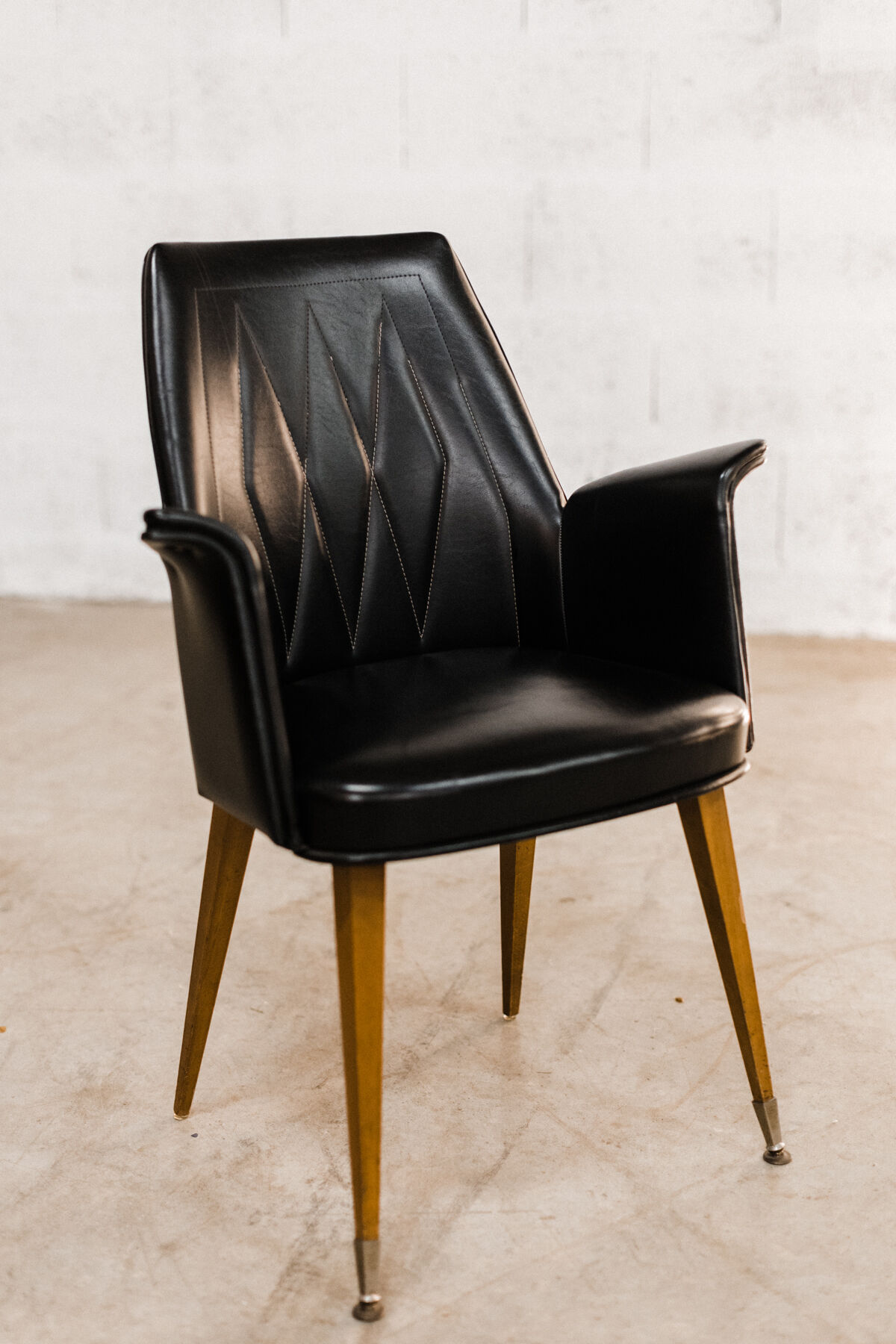 Armchairs / chairs in black skaï "emelinne"